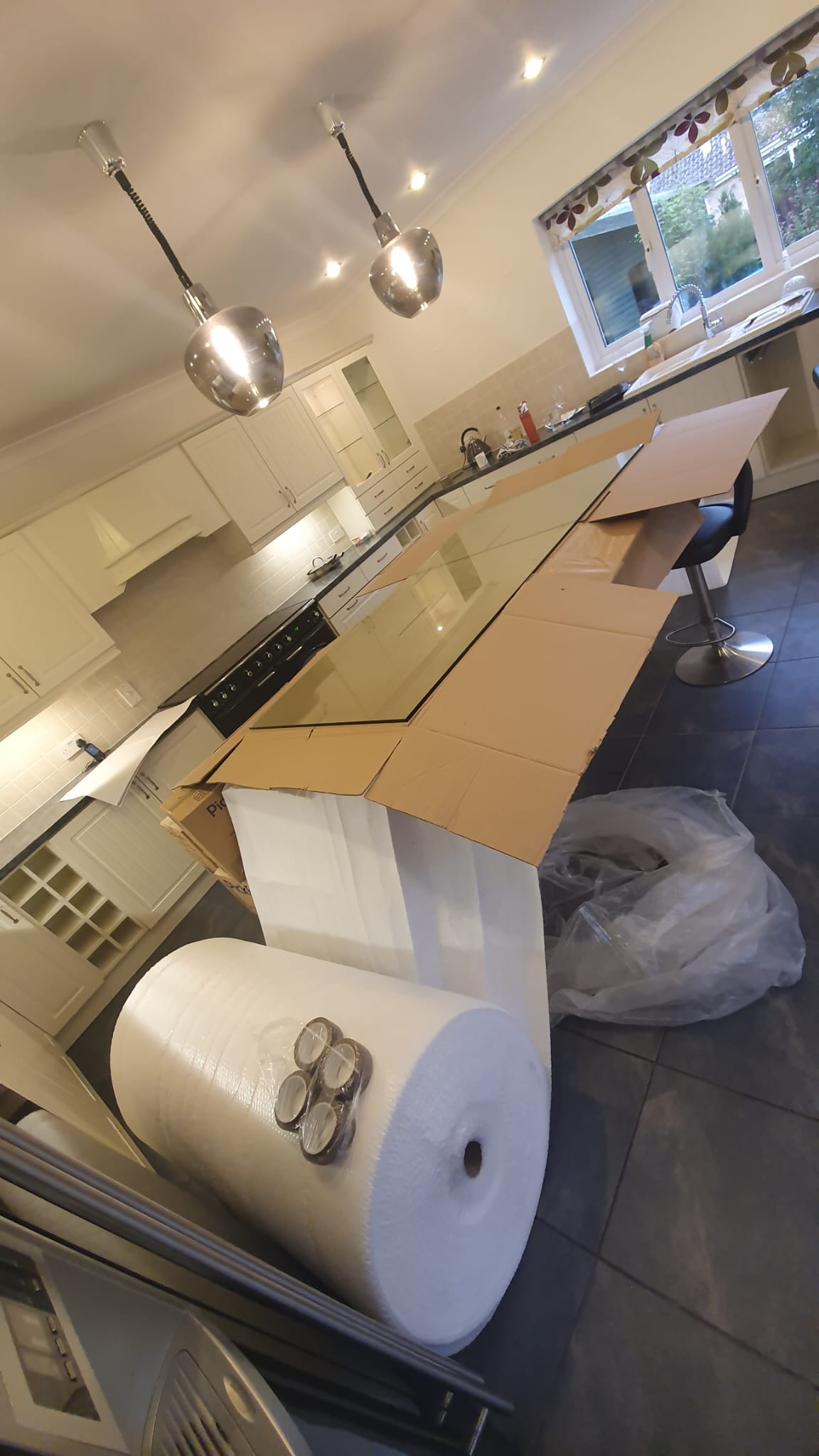 Large glass table top wrapped for secure move