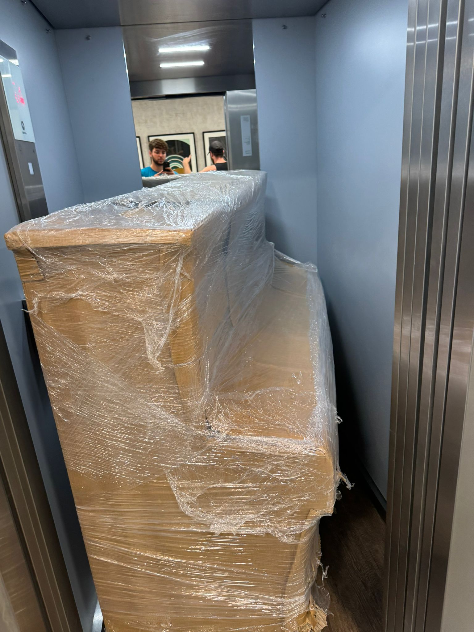 Upright piano did not fit in the lift, so it was carried up the stairs