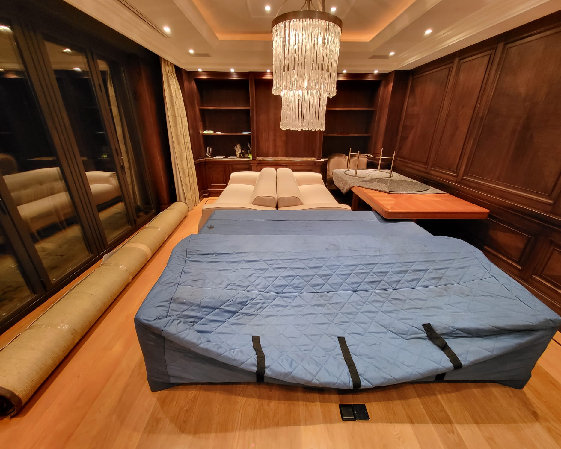 Sofas covered in quilted bags ready for transportation