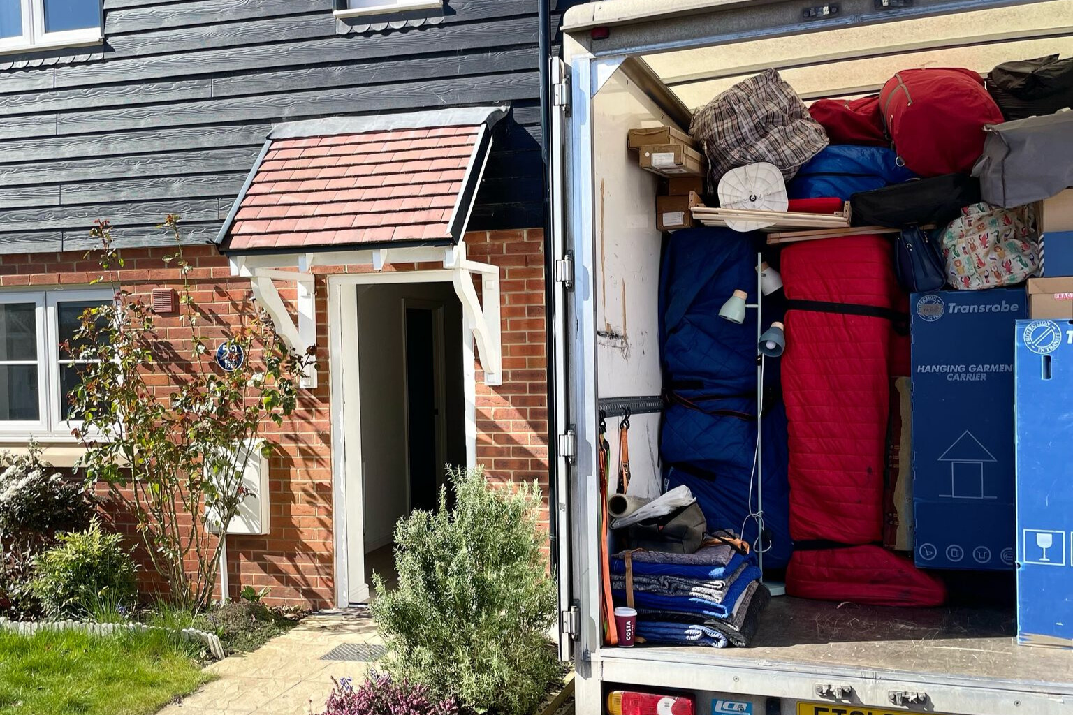 Loaded removal van outside a home