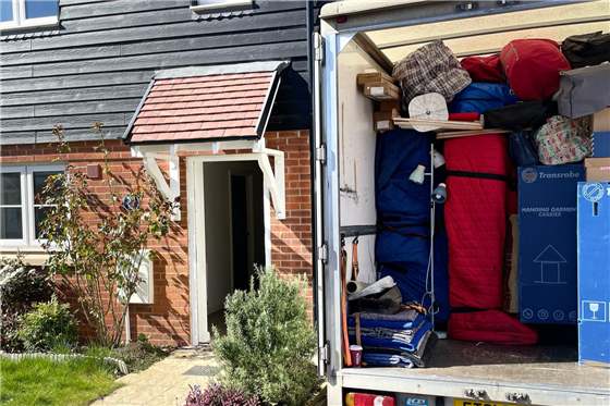 Loaded removal van outside a home